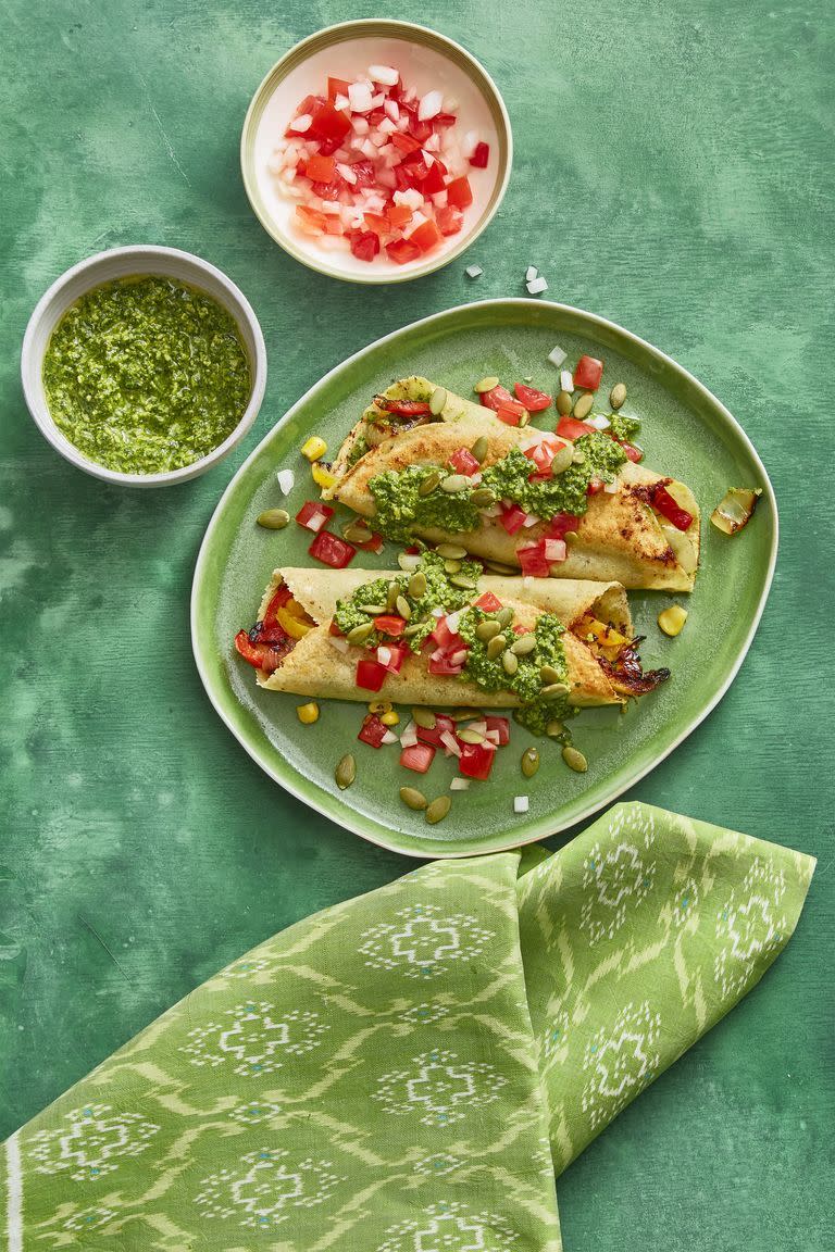 <p>Add a little Latin flair to your vegetarian Christmas dinner with these delicious enchiladas that carry your love of pumpkin over into December. <em><br></em></p><p><em>Get the <a href="https://www.womansday.com/food-recipes/food-drinks/recipes/a60792/enchiladas-with-pumpkin-seed-salsa-recipe/" rel="nofollow noopener" target="_blank" data-ylk="slk:Enchiladas with Pumpkin Seed Salsa recipe;elm:context_link;itc:0;sec:content-canvas" class="link ">Enchiladas with Pumpkin Seed Salsa recipe</a>.</em></p>