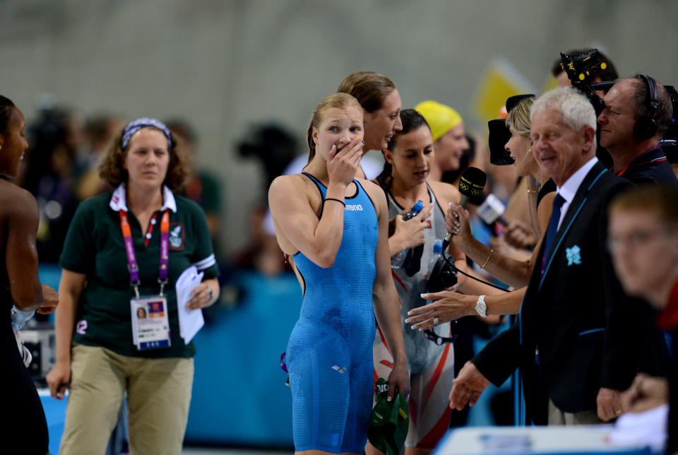 Ruta Meilutyte of Lithuania reacts after winning the women's 100m breaststroke final at the Aquatic Centre during the Olympic Games in London, Monday, July 30, 2012. (AAP Image/Tracey Nearmy) NO ARCHIVING
