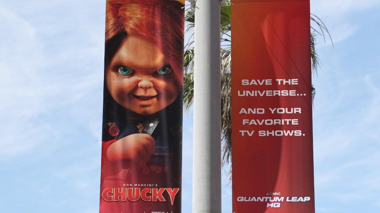  A poster with Chucky doll. 