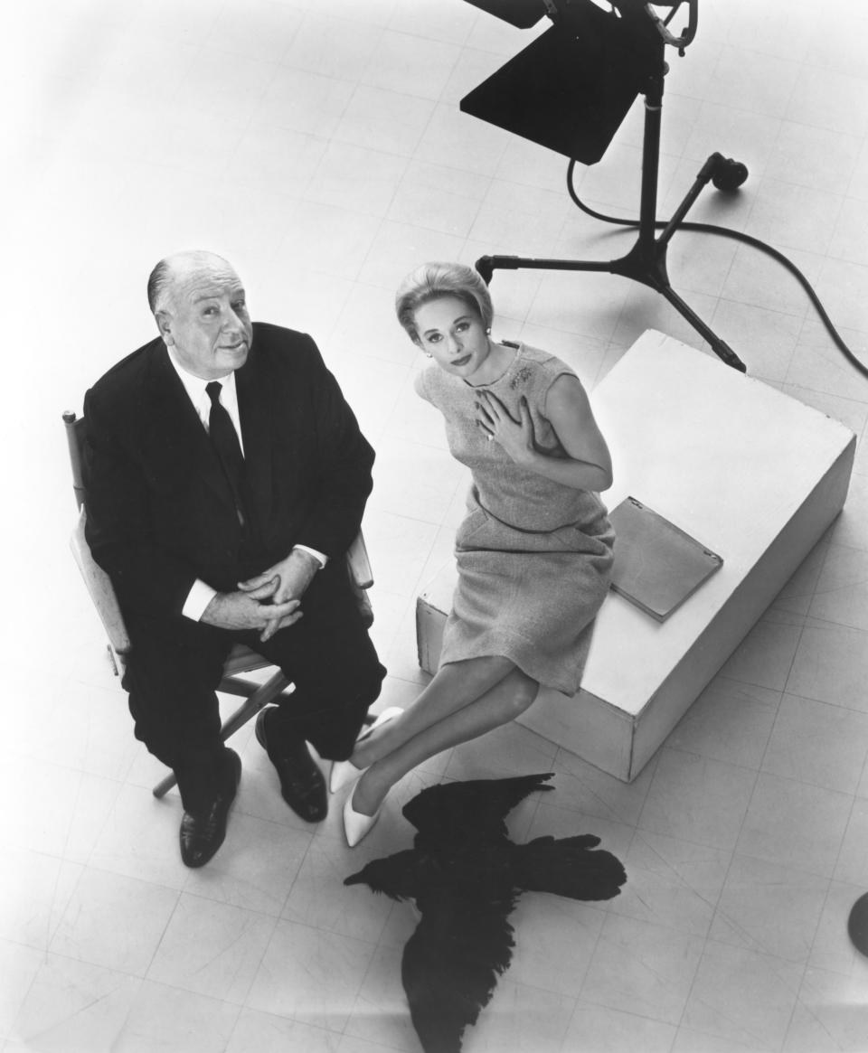 Tippi Hedren with British director and producer Alfred Hitchcock on the set of Hitchcock’s movie The Birds. (Credit: Universal Pictures/Sunset Boulevard/Corbis via Getty Images)