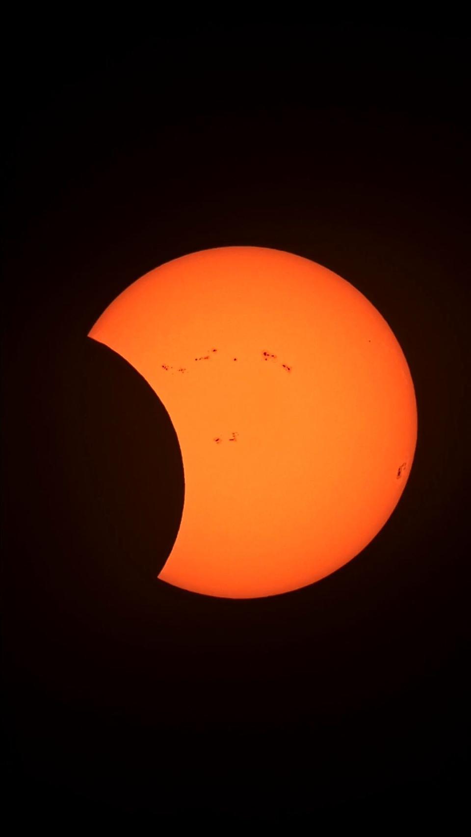 the sun is increasingly overshadowed by the moon during the annular solar eclipse