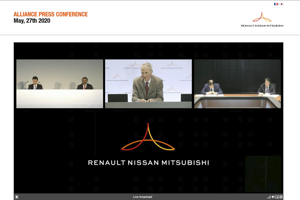 In this image from a video provided by Renault-Nissan-Mitsubishi, Alliance Operating Board Chairman Jean-Dominique Senard, center, Nissan Chief Executive Makoto Uchida, left, and Mitsubishi Motors Chairman, Osamu Masuko, second right, listen to a reporter's question during an online news conference Wednesday, May 27, 2020. The Japanese-French auto alliance of Nissan and Renault will be sharing more vehicle parts, technology and models to save costs as the industry struggles to survive the coronavirus pandemic. (Renault-Nissan-Mitsubishi via AP)
