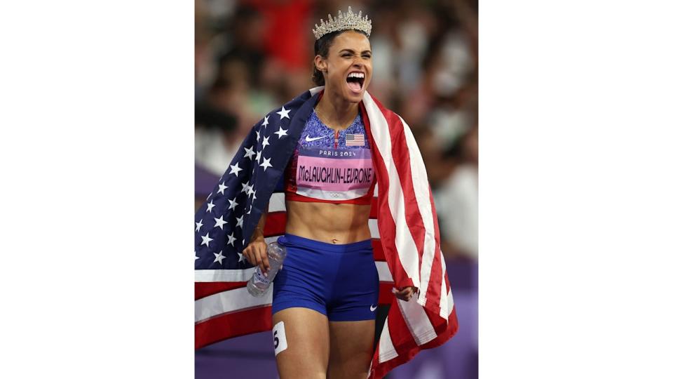 Team USA's Sydney McLaughlin-Levrone celebrates winning the gold medal after competing in the Women's 400m Hurdles final