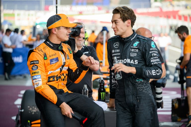 Mercedes' driver George Russell (R) chats to fellow Briton Lando Norris of McLaren after qualifying in Austria (Jure Makovec)