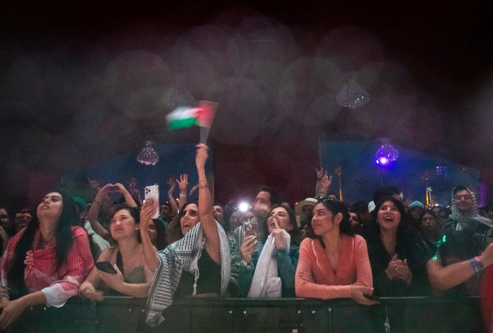 Festivalgoers cheer for Saint Levant as he performs at the Gobi tent during the Coachella Valley Music and Arts Festival in Indio, Calif., Saturday, April 13, 2024.