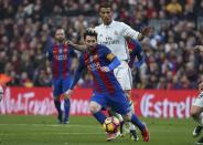 Football Soccer - Barcelona v Real Madrid - Spanish La Liga Santander- Nou Camp Stadium, Barcelona, Spain - 3/12/16. Real Madrid's Cristiano Ronaldo and Barcelona's Lionel Messi in action during the "Clasico". REUTERS/Sergio Perez TPX IMAGES OF THE DAY