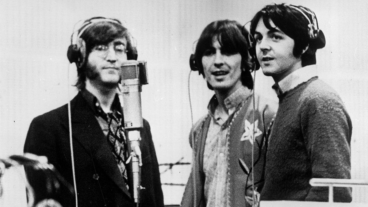 1968: Three Beatles; from left to right John Lennon (1940 - 1980), George Harrison (1943 - 2001) and Paul McCartney, record voices in a studio for their new cartoon film 'Yellow Submarine' 