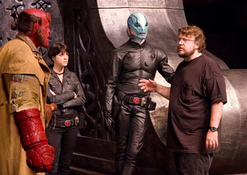 Guillermo del Toro with Ron Perlman as Hellboy, Selma Blair as Liz Sherman and Doug Jones as Abe Sabien on the set of 2008's 'Hellboy II: The Golden Army' (credit: Universal)