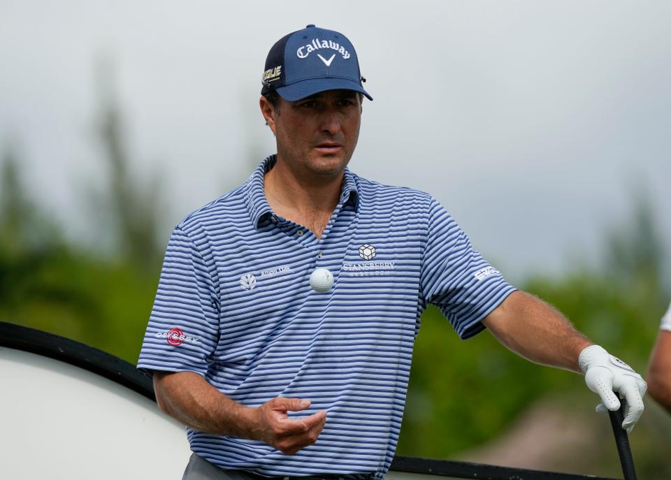 Kevin Kisner, of United States, tosses a ball while waiting to tee off at the first hole during the first round of the Hero World Challenge PGA Tour at the Albany Golf Club, in New Providence, Bahamas, Thursday, Dec. 1, 2022. (AP Photo/Fernando Llano)