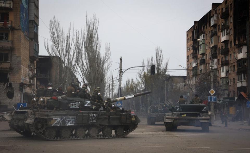 Russian military vehicles move in an area controlled by Russian-backed separatist forces in Mariupol (AP)