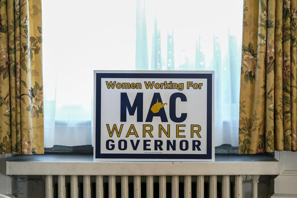 A sign is displayed at a campaign event for West Virginia gubernatorial candidate Mac Warner  (Jeff Dean / AP file)