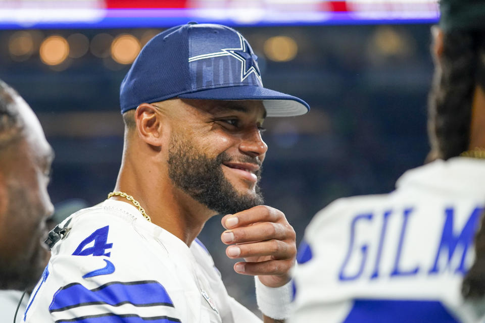 Dallas Cowboys quarterback Dak Prescott smiles during the second half of a preseason NFL football game against the Seattle Seahawks Saturday, Aug. 19, 2023, in Seattle. (AP Photo/Lindsey Wasson)