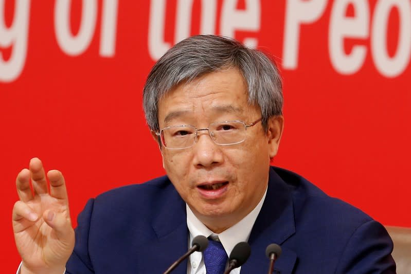 Governor of People's Bank of China (PBOC) Yi Gang attends a news conference on China's economic development ahead of the 70th anniversary of its founding, in Beijing