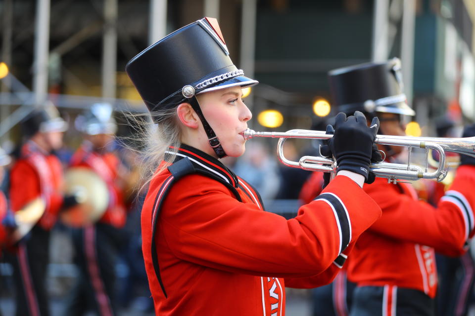 <p>A member of the Hinsdale Central High School Red Devil Marching Band from Hinsdale, Ill. performs during the Veterans Day parade in New York on Nov. 11, 2017. (Photo: Gordon Donovan/Yahoo News) </p>