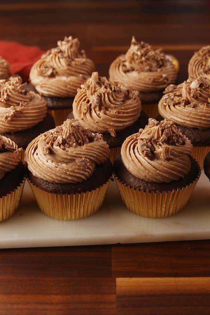 <p>With decadent chocolate cake and a creamy Nutella icing, these cupcakes are a chocolate lover's dream.</p><p><em><strong>Get the recipe at <a href="https://www.delish.com/cooking/recipe-ideas/recipes/a56206/ferrero-rocher-stuffed-cupcakes-recipe/" rel="nofollow noopener" target="_blank" data-ylk="slk:Delish;elm:context_link;itc:0;sec:content-canvas" class="link ">Delish</a>.</strong></em></p><p><strong>What You'll Need: </strong><a href="https://www.amazon.com/Ferrero-Nutella-Hazelnut-Spread-26-5/dp/B00OFVLPD6/?tag=syn-yahoo-20&ascsubtag=%5Bartid%7C10070.g.1966%5Bsrc%7Cyahoo-us" rel="nofollow noopener" target="_blank" data-ylk="slk:Nutella;elm:context_link;itc:0;sec:content-canvas" class="link ">Nutella</a> ($6, Amazon)<strong><br></strong></p>