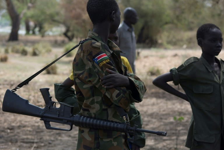 Child soldiers attend a disarmament, demobilisation and reintegration ceremony in Pibor, South Sudan, in 2015