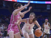 Penn State's Shay Ciezki (4) goes to the basket on Iowa's Caitlin Clark (22) during the first half of an NCAA college basketball game, Sunday, Feb. 5, 2023, in State College, Pa. (AP Photo/Gary M. Baranec)