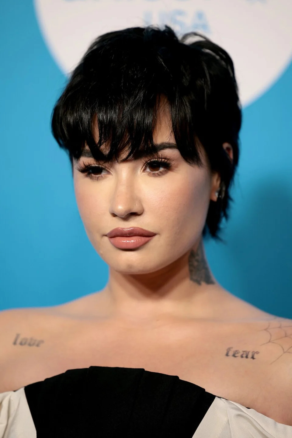 Demi Lovato Shines in Elegant Off-the-Shoulder Gown that Showcases Her 'Love' and 'Fear' Tattoos