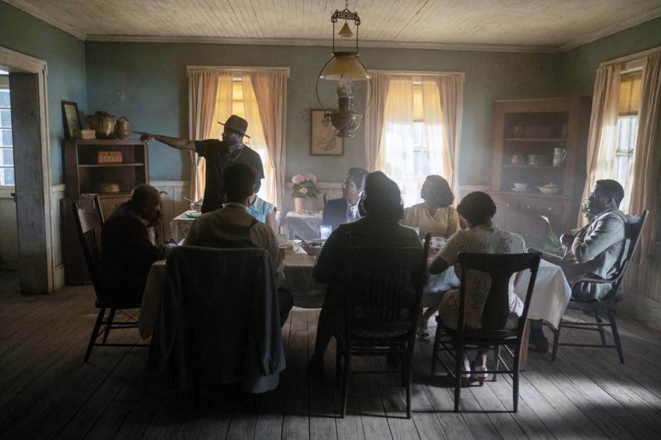 THE COLOR PURPLE, director Blitz Bazawule (standing) with clockwise from left: Louis Gossett Jr., H.E.R., Jon Batiste, Taraji P. Henson, Colman Domingo, Fantasia Barrino, Danielle Brooks, Corey Hawkins, on set, 2023. ph: Eli Ade / © Warner Bros. / Courtesy Everett Collection