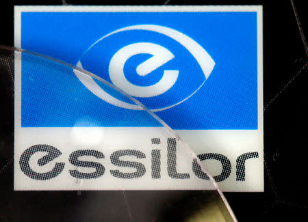FILE PHOTO: Lens producers Essilor' s logo is seen in an optician shop in Paris, France, March 15, 2016. REUTERS/Philippe Wojazer/File Photo