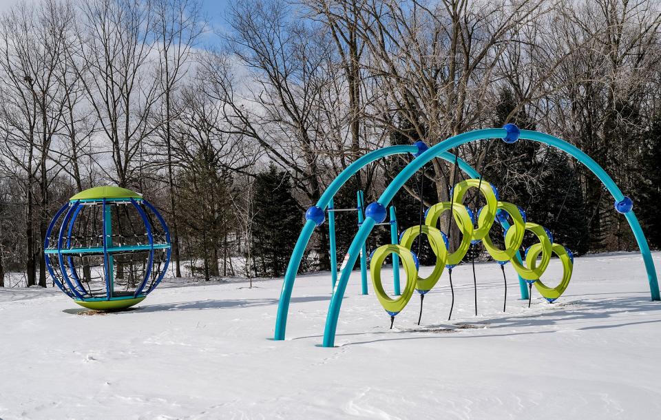 Some brightly colored playground equipment on display at Fulton Park in south Lansing Saturday, Feb. 19, 2022.