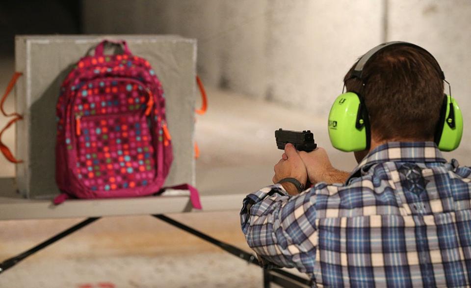 Chief Operating Officer for Amendment II, Rich Brand, shoots a child's backpack with their Rynohide CNT Shield in it in Salt Lake City, Utah.