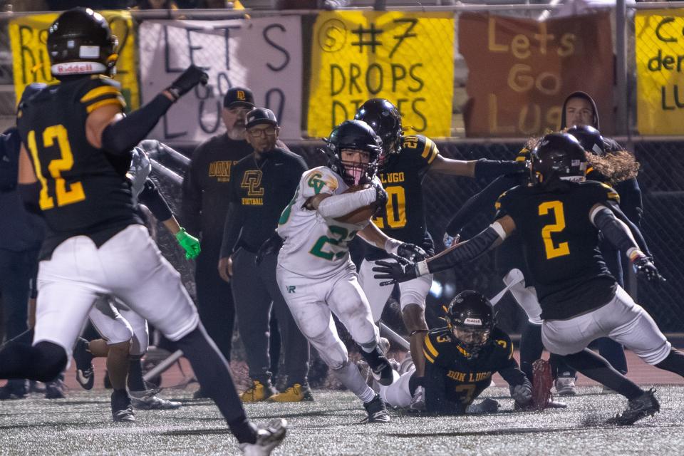 Coachella Valley's Aaron Ramirez (23) finds a clear path to advance against Don Lugo during the CIF-SS Division 12 playoffs in Chino, California, on November 10, 2023.