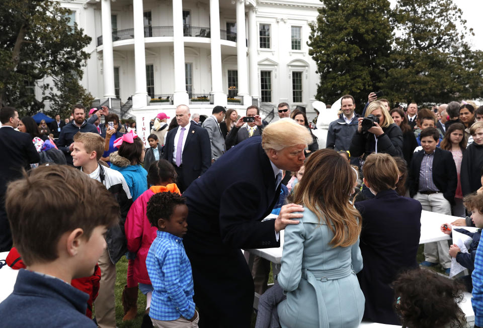 <p>U.S. President Donald Trump kisses first lady Melania Trump among children gathered for the annual White House Easter Egg Roll on the South Lawn of the White House in Washington, U.S., April 2, 2018. (Photo: Leah Millis/Reuters) </p>