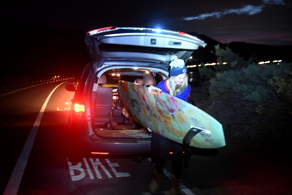 Dana Bisenius of Newbury Park gets ready at 6 a.m. to surf at Mondos Beach just north of Ventura on Dec. 1.