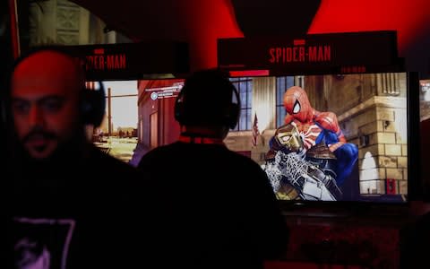 An attendee plays the Spider-Man video game during the Sony Corp. Playstation event - Credit: Bloomberg