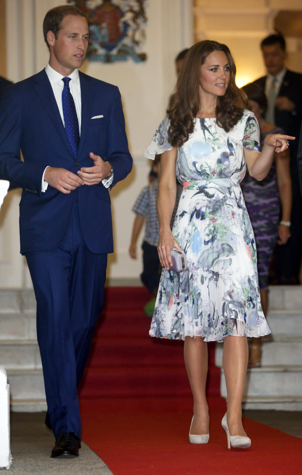 <p>For a reception in Singapore, Kate opted for a lightweight Erdem dress featuring floral detailing. She accessorised with suede L.K. Bennett heels and a grey clutch. </p><p><i>[Photo: PA]</i></p>