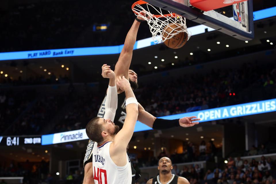 Mar 31, 2023; Memphis, Tennessee, USA; Memphis Grizzlies forward David Roddy (27) dunks over Los Angeles Clippers center Ivica Zubac (40) during the first half at FedExForum. Mandatory Credit: Petre Thomas-USA TODAY Sports