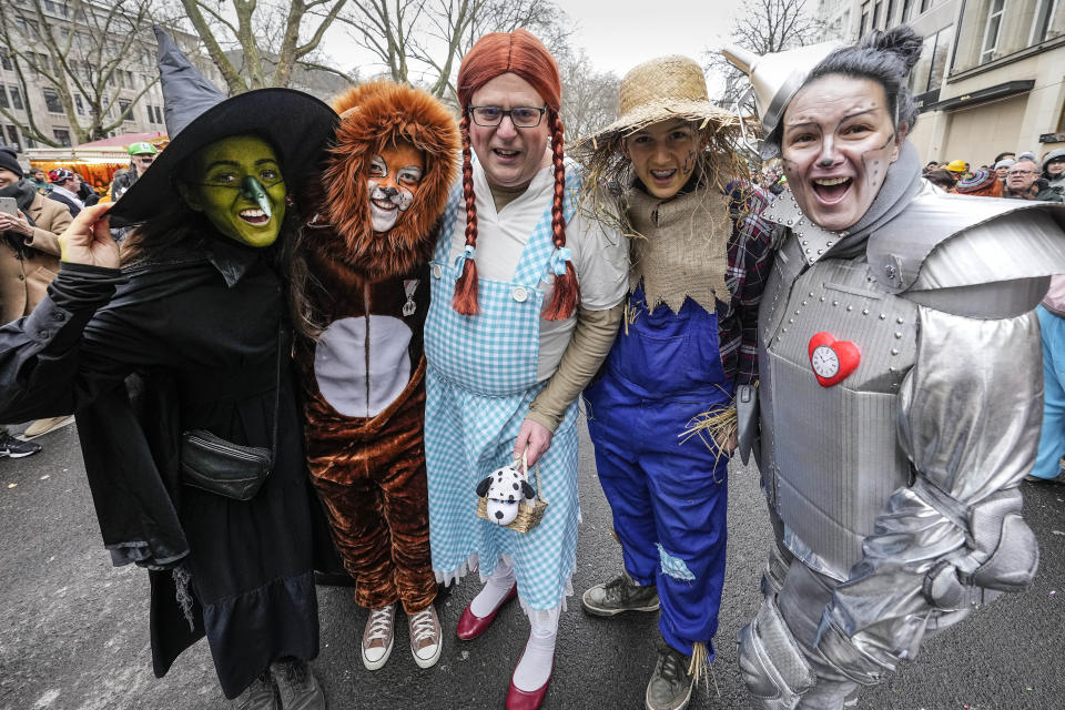 Revellers dressed like the Wizard of Oz pose ahead of the traditional carnival parade in Duesseldorf, Germany, on Monday, Feb. 20, 2023. The foolish street spectacles in the carnival centers of Duesseldorf, Mainz and Cologne, watched by hundreds of thousands of people, are the highlights in Germany's carnival season on Rosemonday. (AP Photo/Martin Meissner)