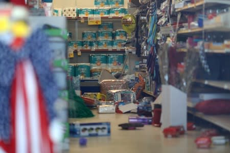 Merchandise, including Independence Day items, are scattered inside a Family Dollar store after anearthquake broke, triggered by a previous day quake, near the epicenter in Trona