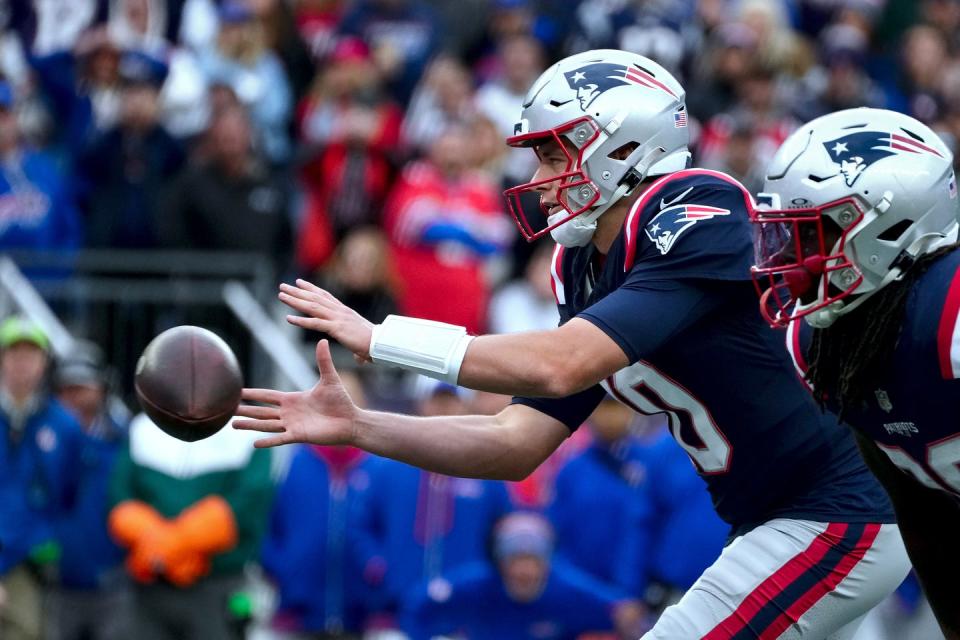 Mac Jones takes a snap in the final seconds of the Pats' win over the Bills on Oc.t 22.