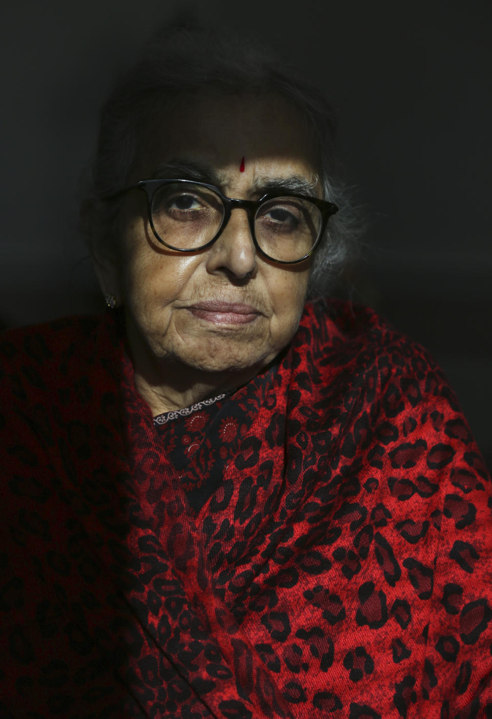 Dr. Uma Mysorekar, president of the Hindu Temple Society of North America, sits in her office in New York City on Friday, Dec. 3, 2021. Located in the Flushing section of New York's Queens borough, the society runs one of the oldest Hindu temples in the United States. (AP Photo/Jessie Wardarski)