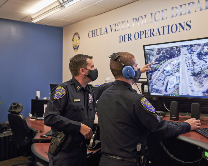 Capt. Don Redmond, left, and Officer Evan Linney monitor a police drone operation from the Chula Vista Police Department's command center, in Chula Vista, Calif., on Nov. 11, 2020. (John Francis Peters / The New York Times / Redux)
