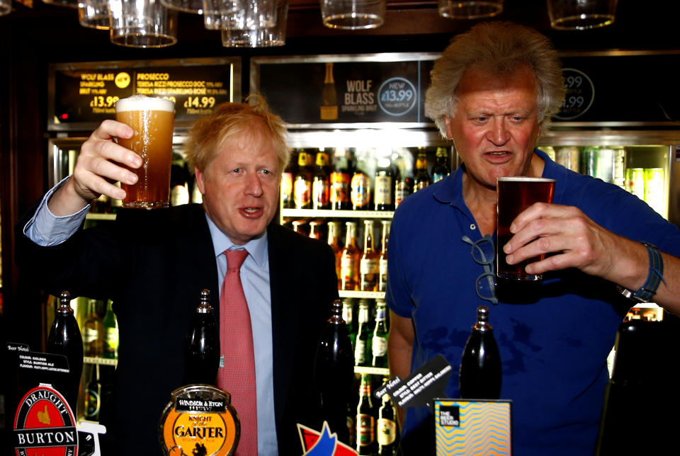 Boris Johnson, a leadership candidate for Britain's Conservative Party, meets JD Wetherspoon chairman Tim Martin at Wetherspoons Metropolitan Bar in London, Britain, July 10, 2019. REUTERS/Henry Nicholls/pool