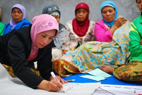 <span class="caption">Women in an Indonesian village plan strategies for reconstruction after extreme weather.</span> <span class="attribution"><a class="link " href="https://www.flickr.com/photos/worldbank/6468600117" rel="nofollow noopener" target="_blank" data-ylk="slk:World Bank/Flickr;elm:context_link;itc:0;sec:content-canvas">World Bank/Flickr</a></span>