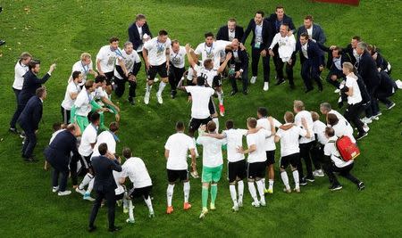 Soccer Football - Chile v Germany - FIFA Confederations Cup Russia 2017 - Final - Saint Petersburg Stadium, St. Petersburg, Russia - July 2, 2017 Germany’s Joshua Kimmich and Emre Can (C) celebrate with team mates after winning the FIFA Confederations Cup. REUTERS/Maxim Shemetov