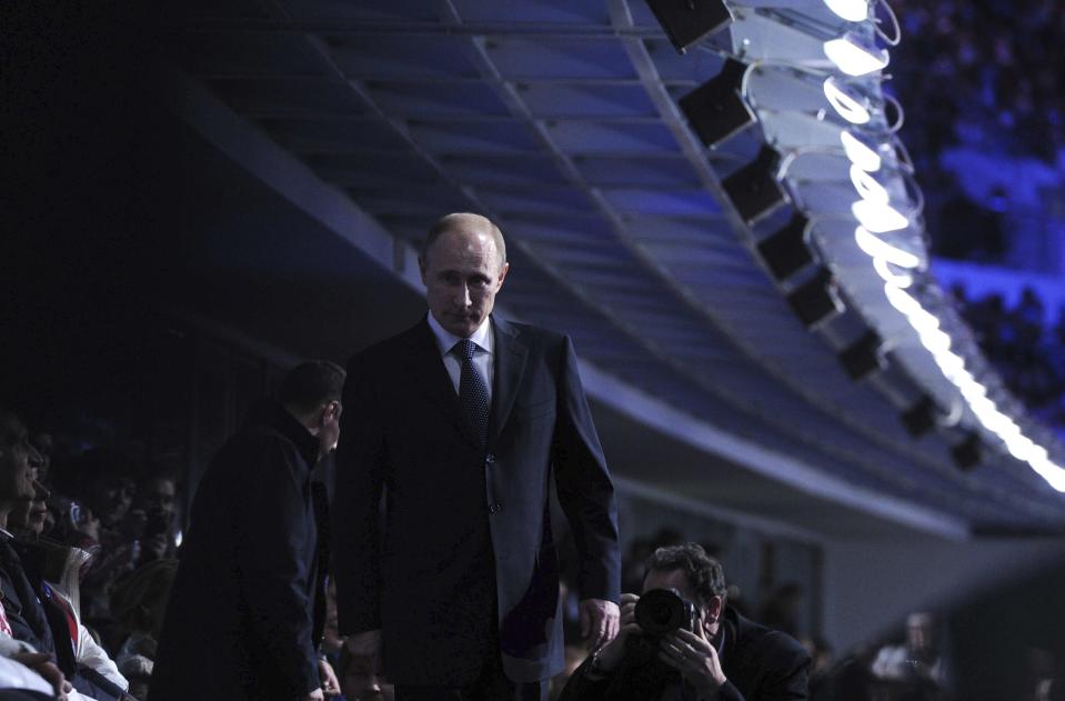 Russia's President Vladimir Putin walks during the closing ceremony for the 2014 Sochi Winter Olympics