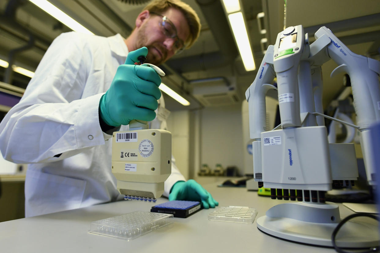 Employee Philipp Hoffmann, of German biopharmaceutical company CureVac, demonstrates research workflow on a vaccine for the coronavirus (COVID-19) disease at a laboratory in Tuebingen, Germany, March 12, 2020. Picture taken on March 12, 2020. REUTERS/Andreas Gebert