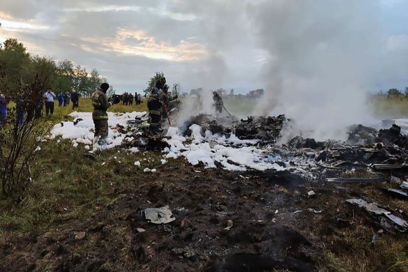 Rescuers work at the site of a plane crash near the village of Kuzhenkino, Tver region, Russia, on Wednesday. Photo by Russian Investigative Committee