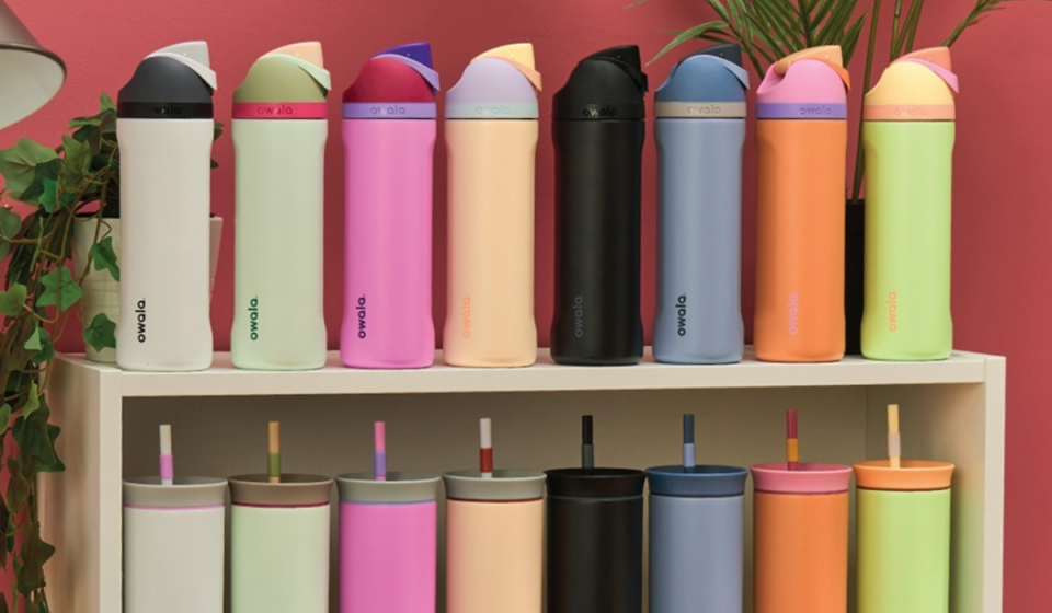 Owala FreeSip Water Bottles are shown lined up on shelf in different colors for Yahoo's best water bottle guide.