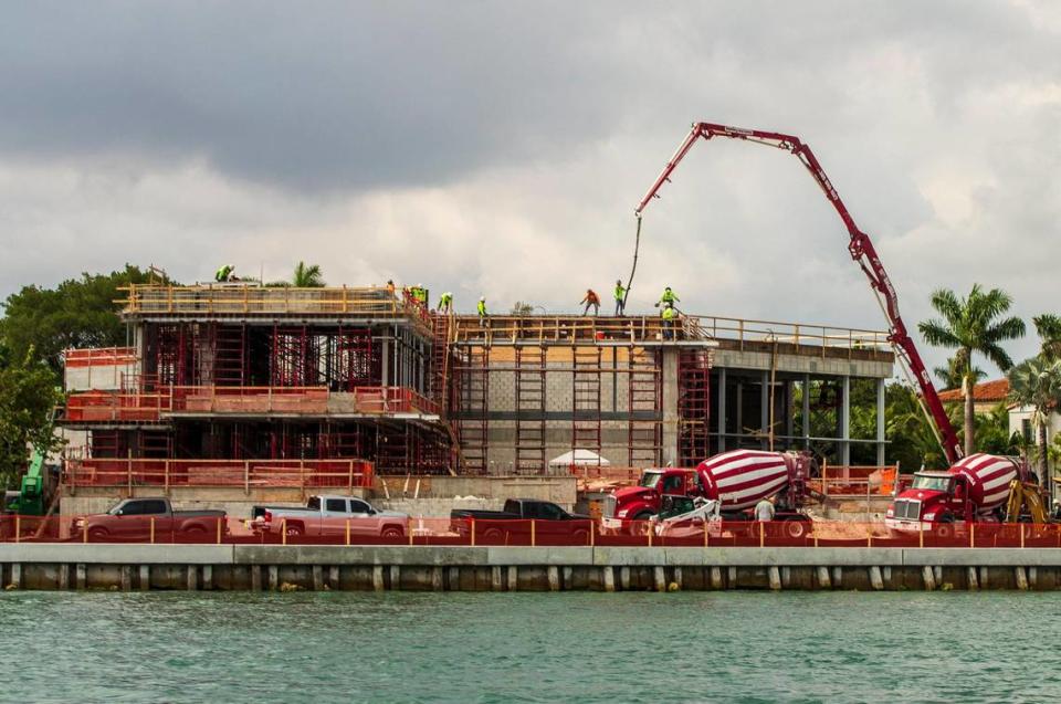 Construction workers seen working on a mansion on Star Island in Miami Beach, on Wednesday, Jan. 26, 2022.