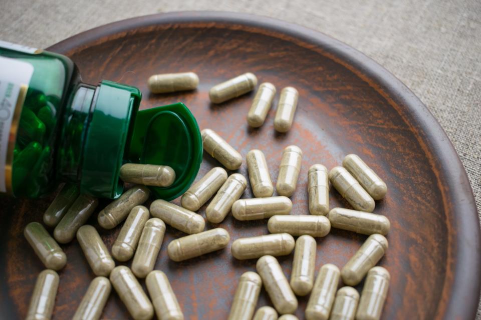 Biotin capsules on a brown plate