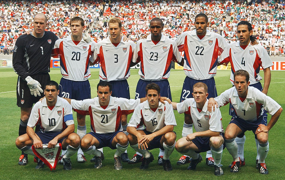 The starting team for a World Cup match against Mexico pose for a photo at Jeonju Stadium, South Korea, June 17, 2002. Left to right, from top: Brad Friedel, Brian McBride, Gregg Berhalter, Eddie Pope, Anthony Sanneh, Pablo Mastroeni, Claudio Reyna, Landon Donovan, Josh Wolff, John O'Brien, and Eddie Lewis. Earnie Stewart came on as a substitute during the game, which USA won 2-0.<span class="copyright">Pascal Guyot—AFP/Getty Images</span>