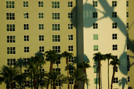 The High Roller, a giant ferris wheel on the strip, casts a shadow on a hotel in Las Vegas, Nevada, U.S., August 27, 2018. Picture taken August 27, 2018. REUTERS/Mike Blake