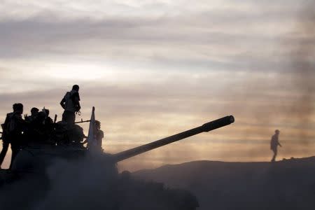 Al-Rahman corps and the Islamic Union for Recruiting the Levant demonstrate their skills during a military training in Marj Al-Ashari, eastern Ghouta of Damascus May 22, 2015. Picture taken May 22, 2015. REUTERS/Mohammed Badra