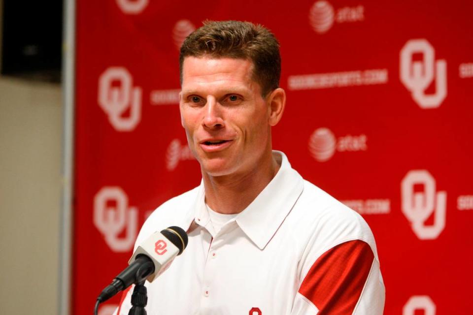 From Aug. 6, 2010, then-Oklahoma defensive coordinator Brent Venables answers a question during a news conference at media day in Norman, Okla.